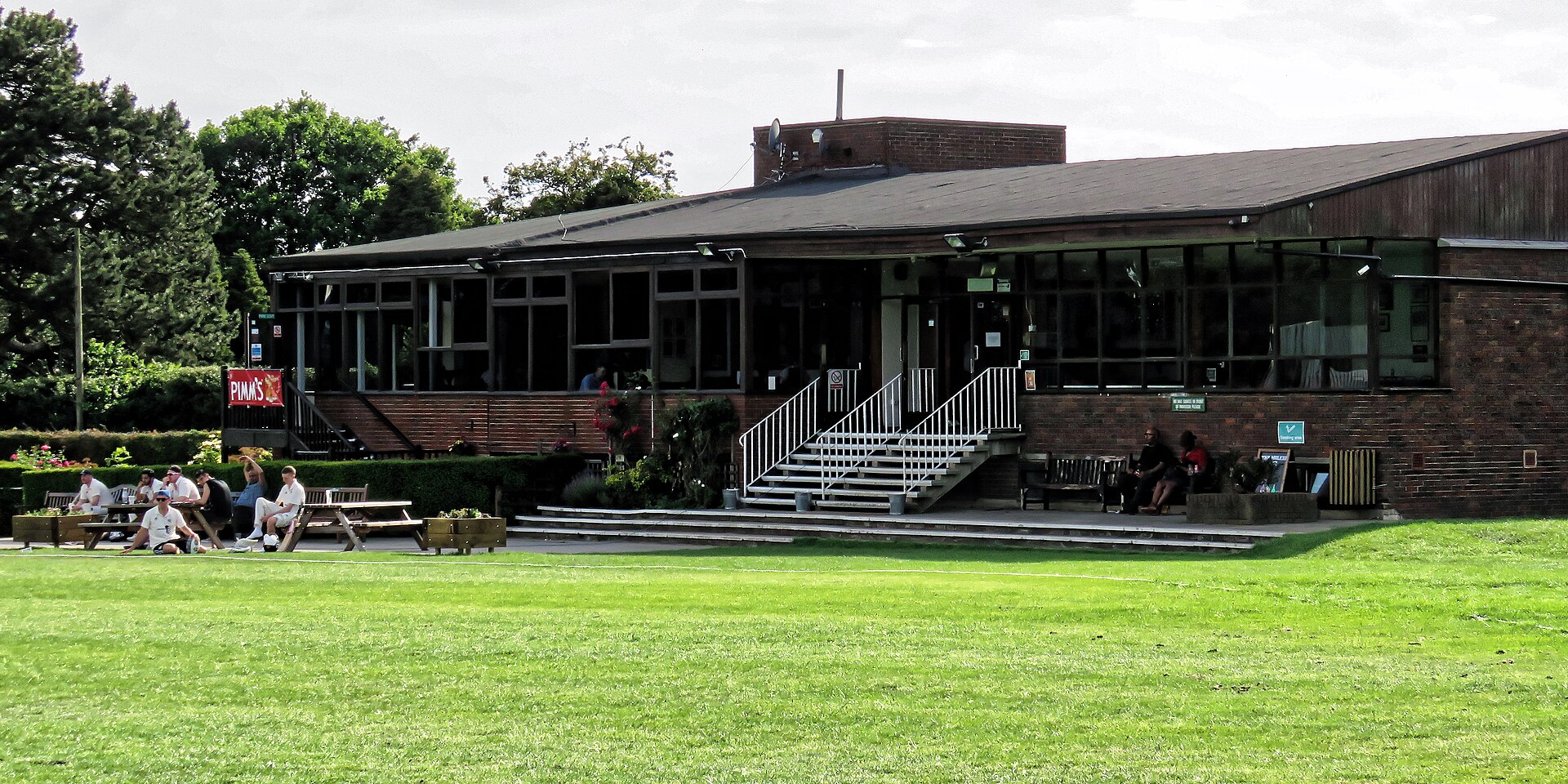 Sample clubhouse and green outfield at Walker Cricket Ground