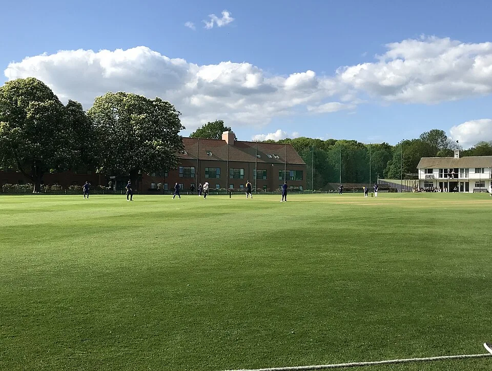 Young players practising cricket on the Ardingly College field. CC0 sample; not Tailor academy photography.